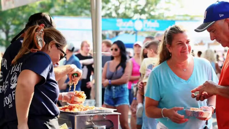 People Enjoy Freshly Prepared Seafood at The Festival of The Sea in New Jersey